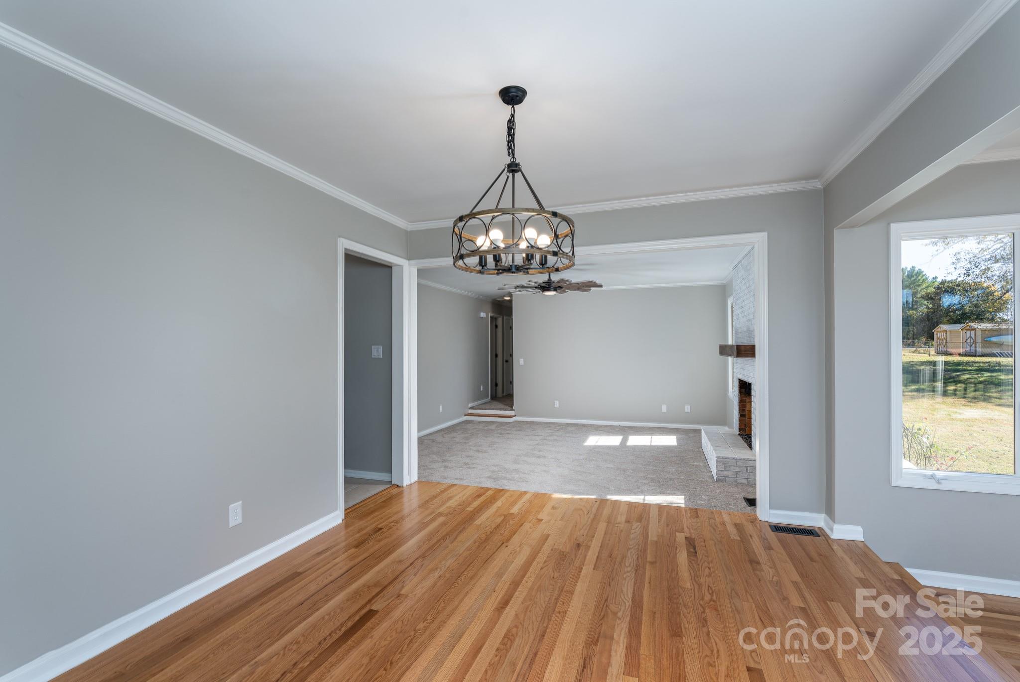 3105 West Zion Church Road Shelby, NC 28150 - Photo 11 of 44 a view of an empty room with wooden floor and windows