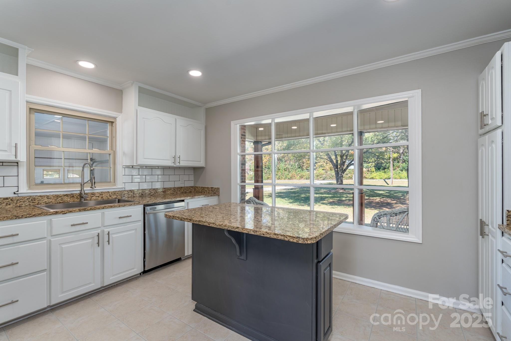 3105 West Zion Church Road Shelby, NC 28150 - Photo 14 of 44 a kitchen with granite countertop a stove and a sink