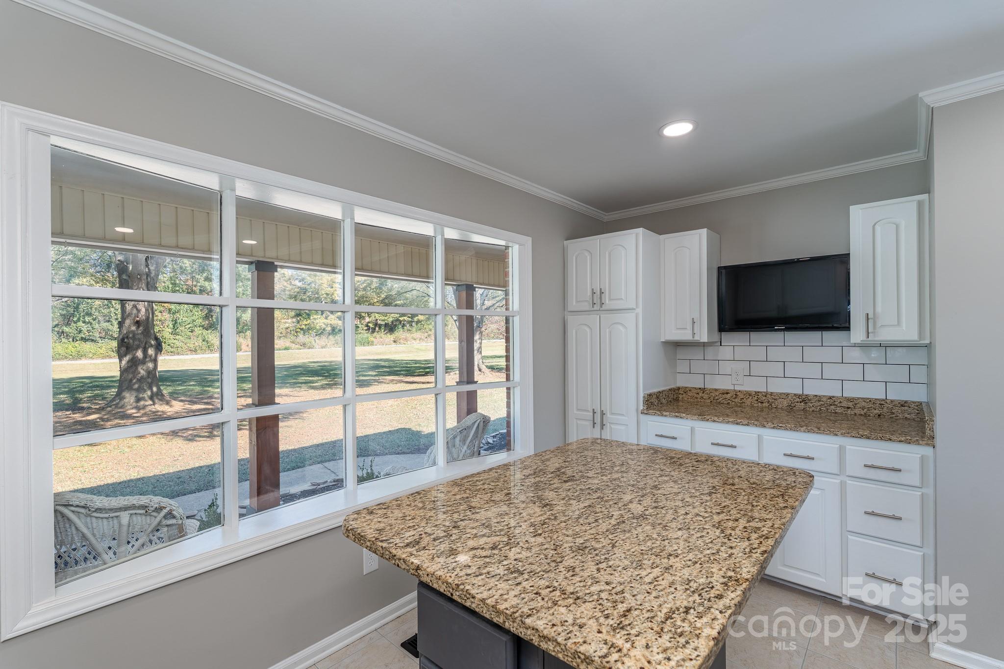 3105 West Zion Church Road Shelby, NC 28150 - Photo 15 of 44 a living room with a large window and a flat screen tv