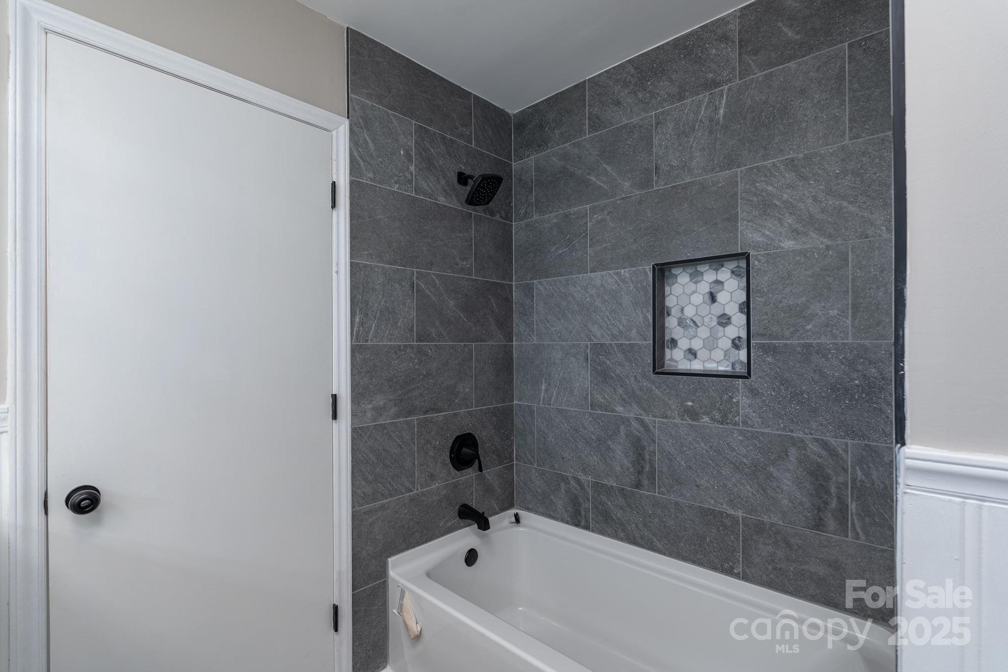 3105 West Zion Church Road Shelby, NC 28150 - Photo 17 of 44 a bathroom with a bathtub and shower