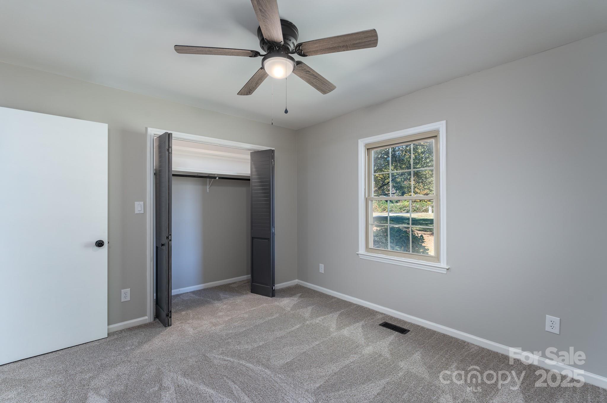 3105 West Zion Church Road Shelby, NC 28150 - Photo 21 of 44 an empty room with windows and fan