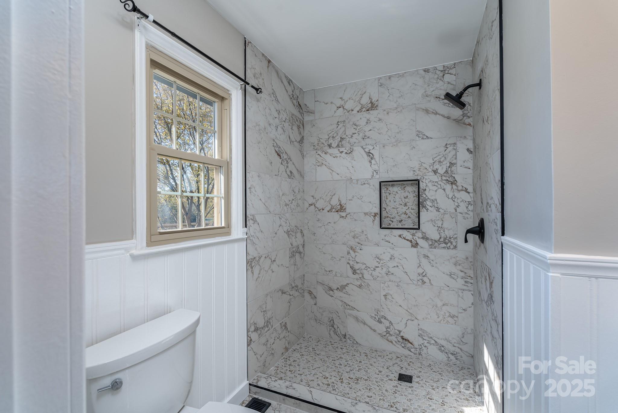 3105 West Zion Church Road Shelby, NC 28150 - Photo 23 of 44 a bathroom with a shower toilet and a sink