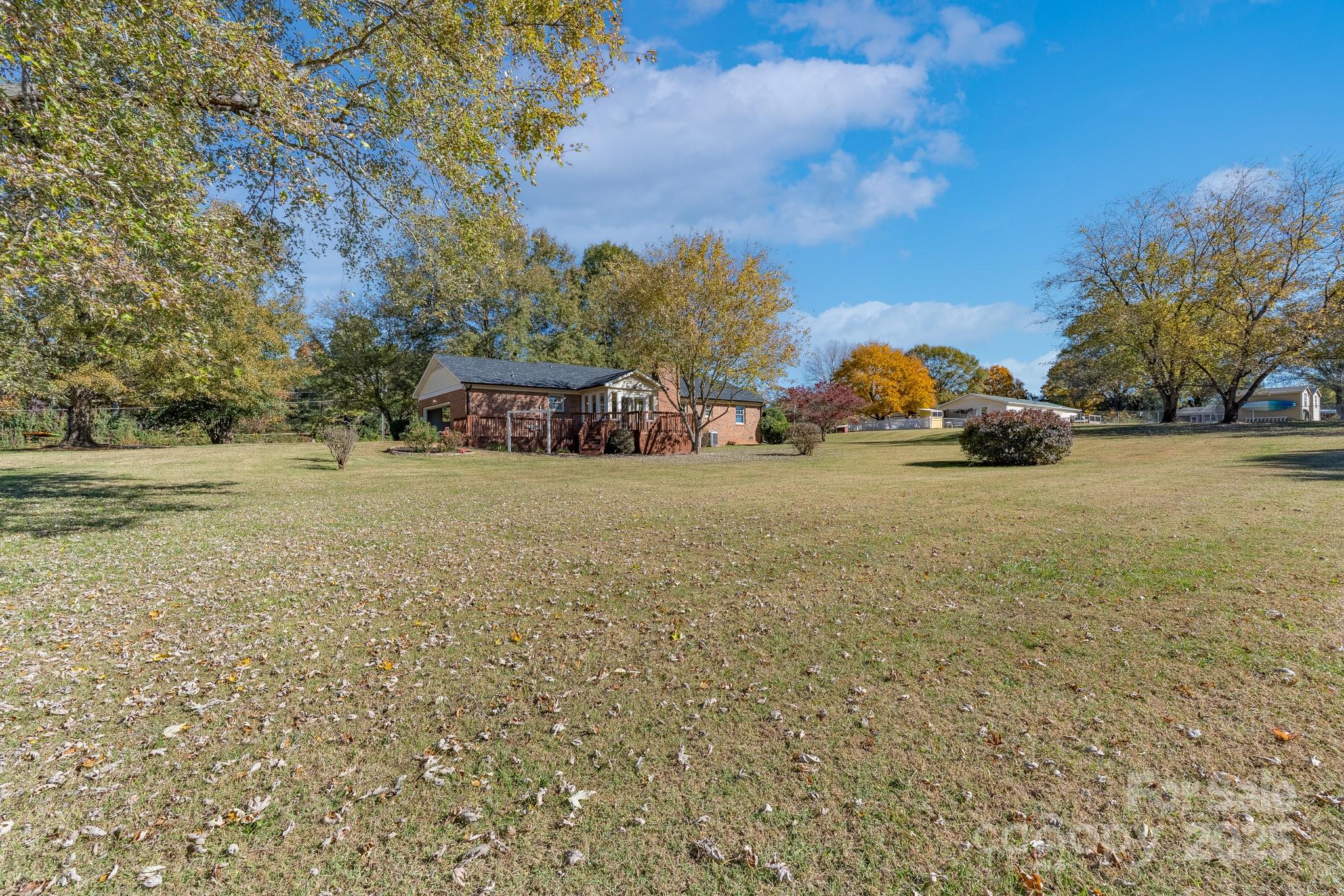 3105 West Zion Church Road Shelby, NC 28150 - Photo 29 of 44 a view of a yard with a car park in front of the house