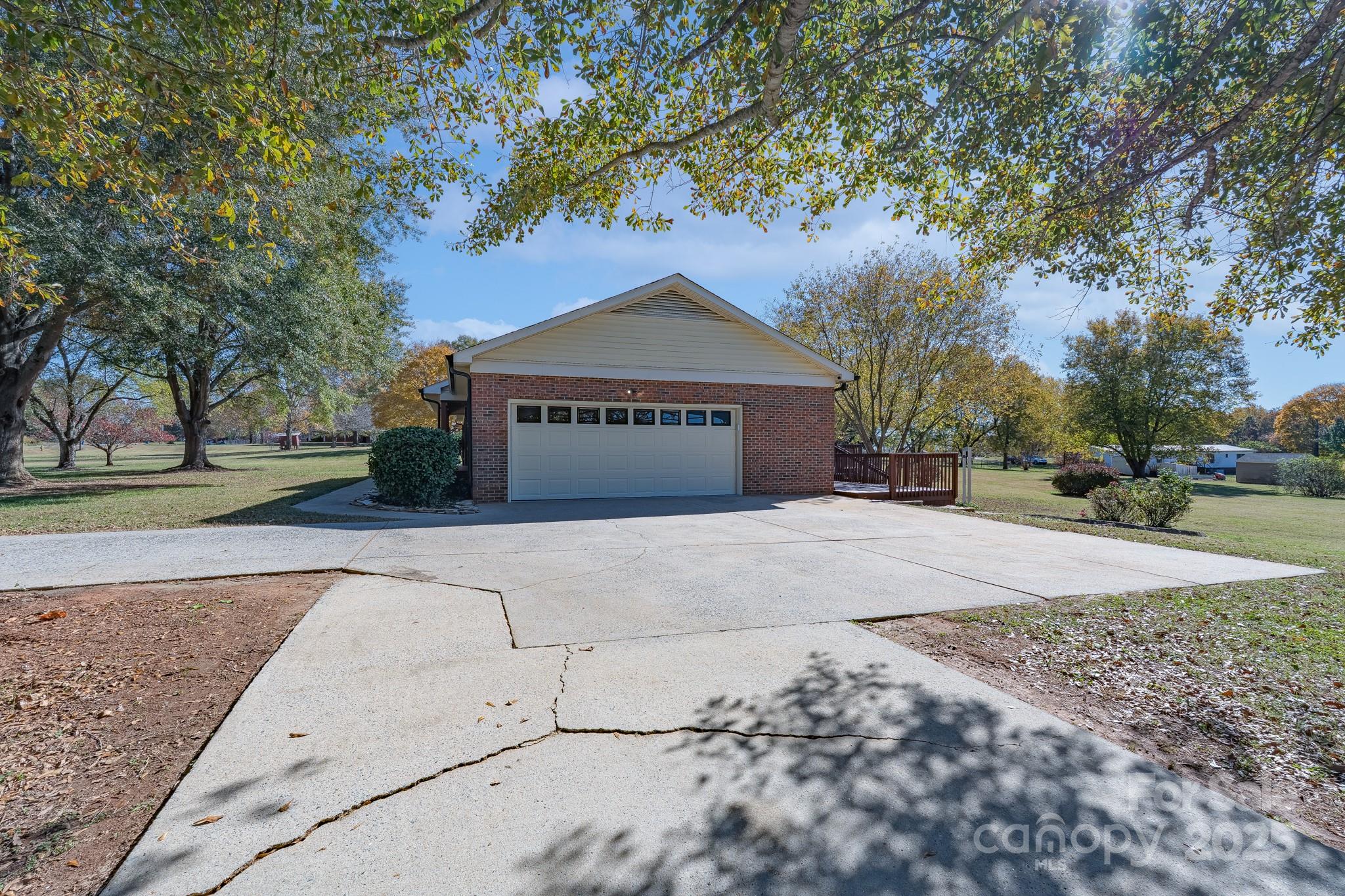3105 West Zion Church Road Shelby, NC 28150 - Photo 3 of 44 a front view of a house with a yard and garage