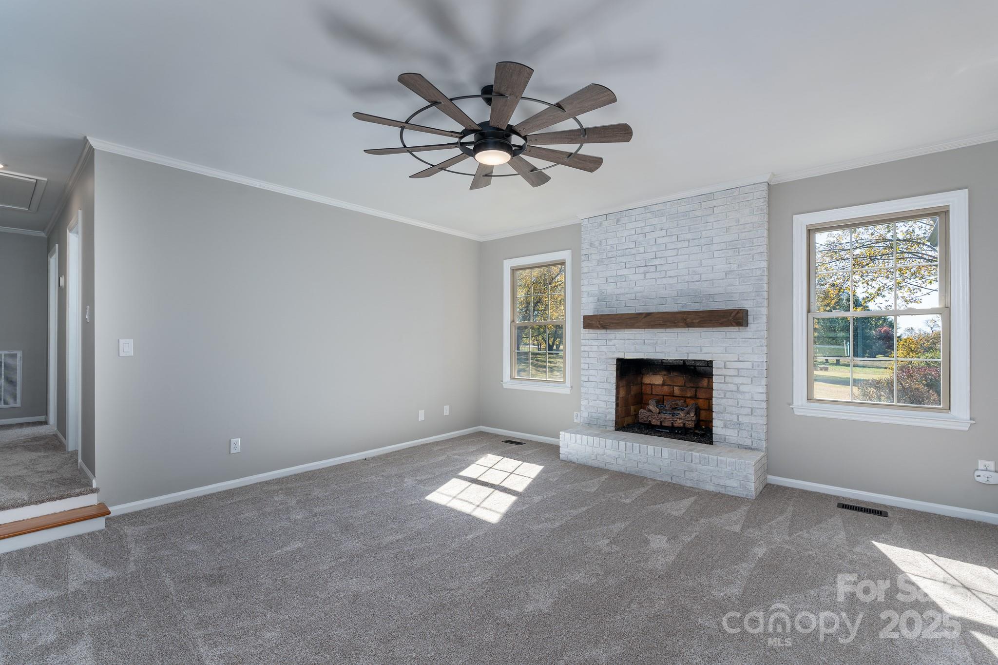 3105 West Zion Church Road Shelby, NC 28150 - Photo 7 of 44 a view of an empty room with window and fireplace