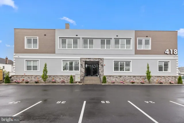 a front view of building with street