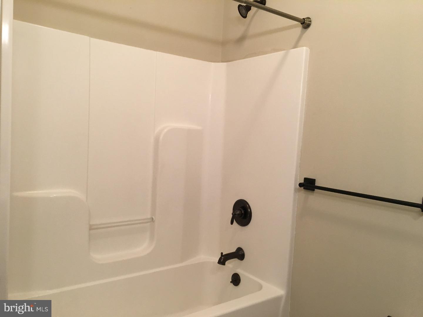 9 North 7th Street, Unit B Perkasie, PA 18944 - Photo 13 of 19 a bathroom with a bathtub