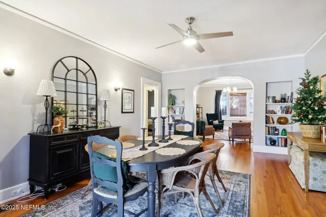 a view of a livingroom with furniture and a large window