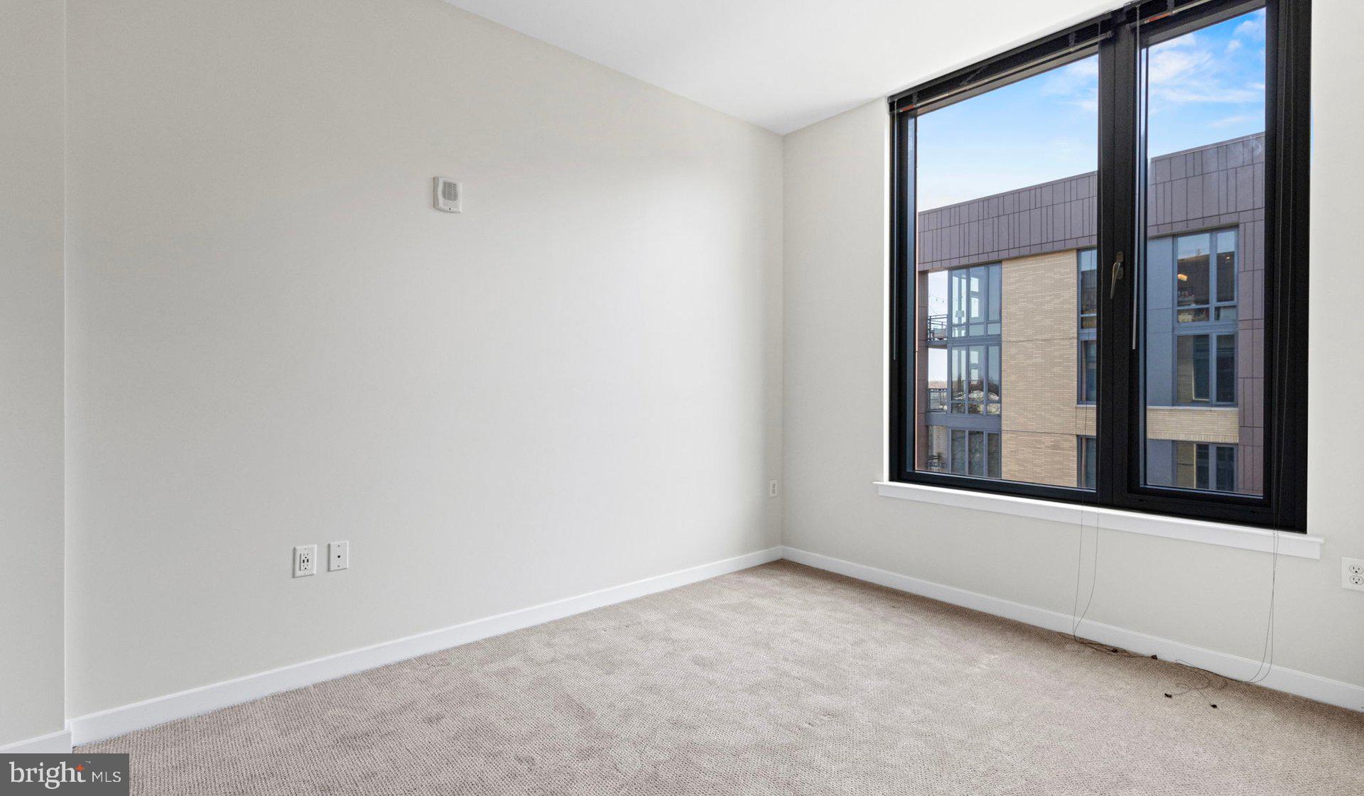 8300 Wisconsin Avenue, Unit 1B1831 Bethesda, MD 20814 - Photo 92 of 150 a view of an empty room with a window