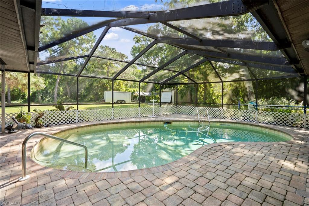 20599 Charing Cross Circle Estero, FL 33928 - Photo 21 of 24 a view of yard with a swimming pool