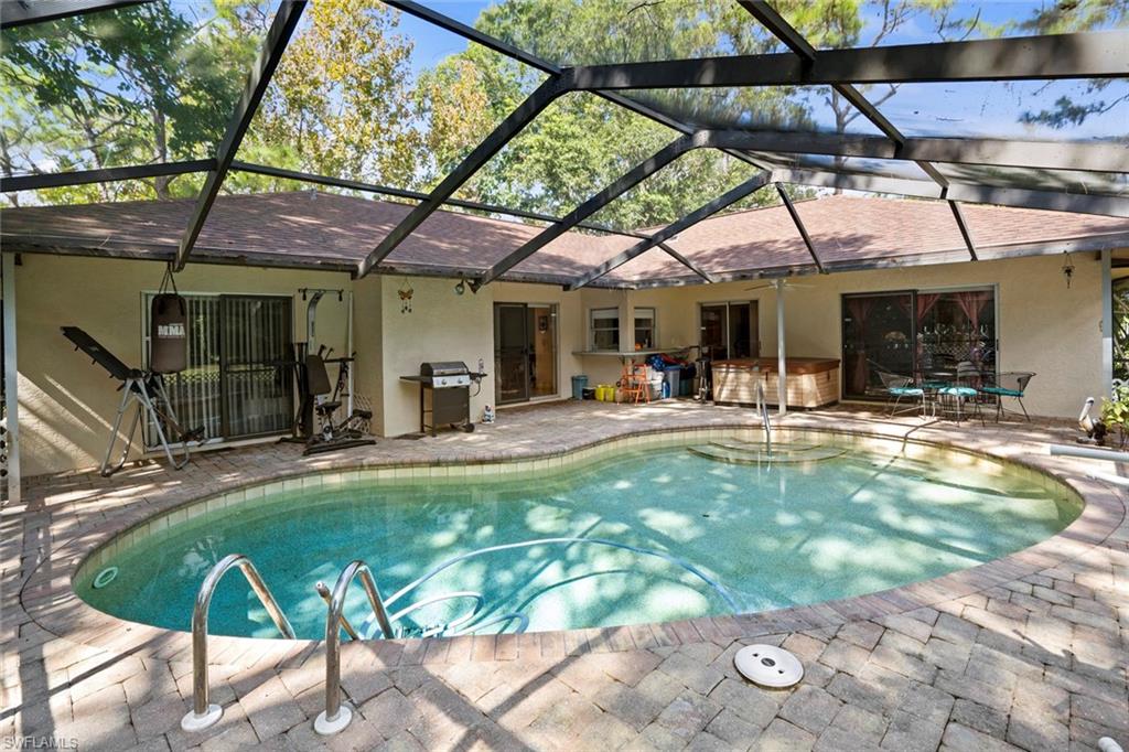 20599 Charing Cross Circle Estero, FL 33928 - Photo 22 of 24 a view of a swimming pool with a patio