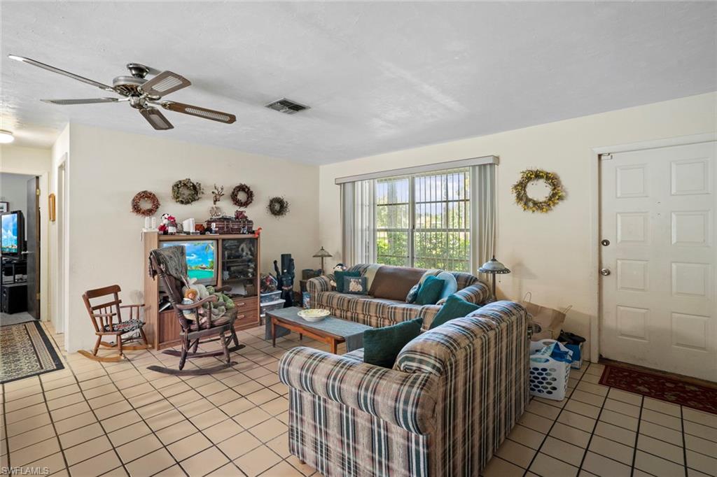 20599 Charing Cross Circle Estero, FL 33928 - Photo 4 of 24 a living room with furniture