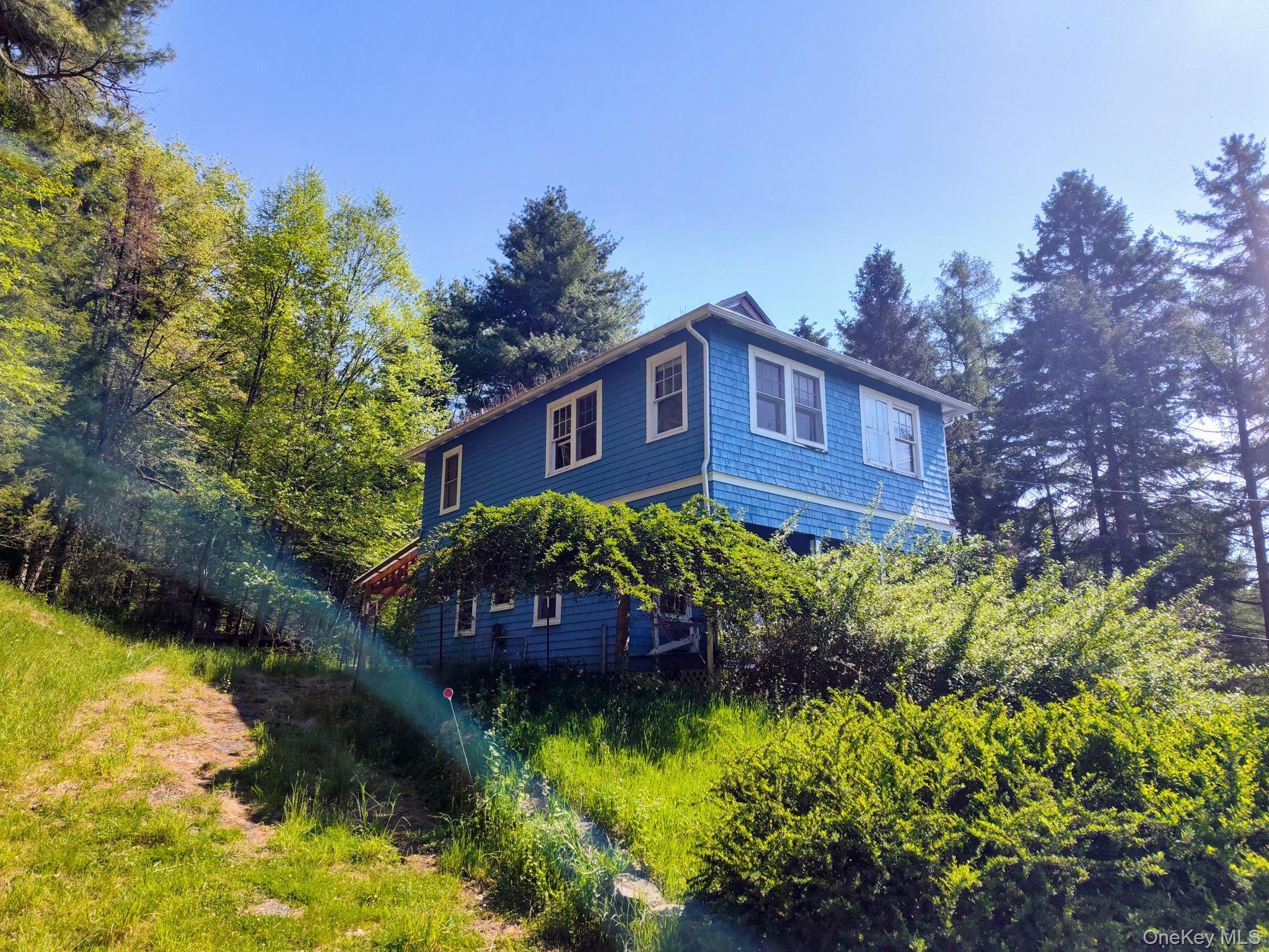 174 Forestburgh Road Forestburgh, NY 12777 - Photo 15 of 28 a view of a house with a yard and garden