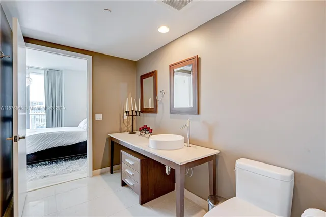 a bathroom with a sink a toilet and vanity