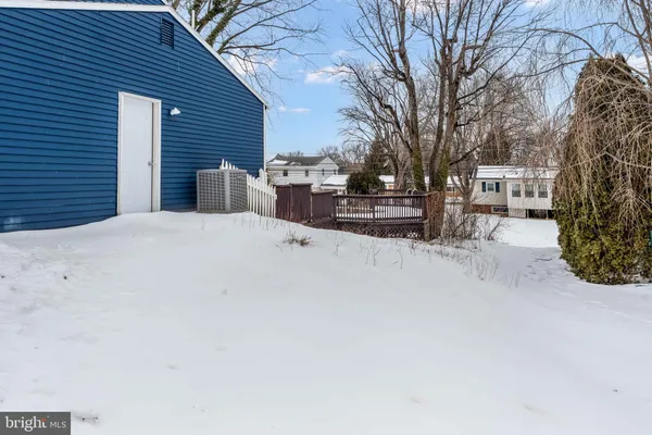 a view of a house with a snow in the yard