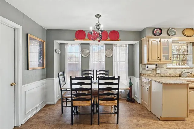 a view of a dining room with furniture and window