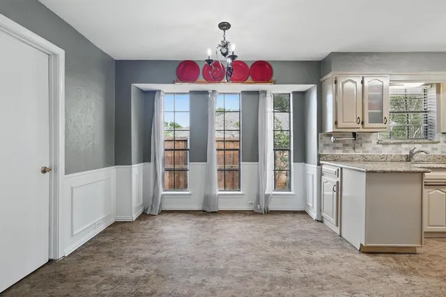 a view of a kitchen with a sink and dishwasher