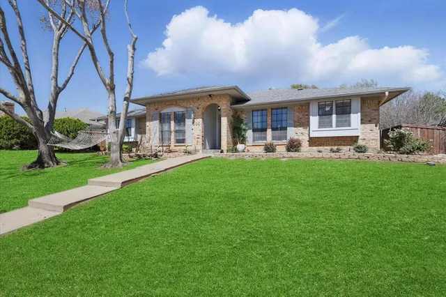 a front view of house with yard patio and green space