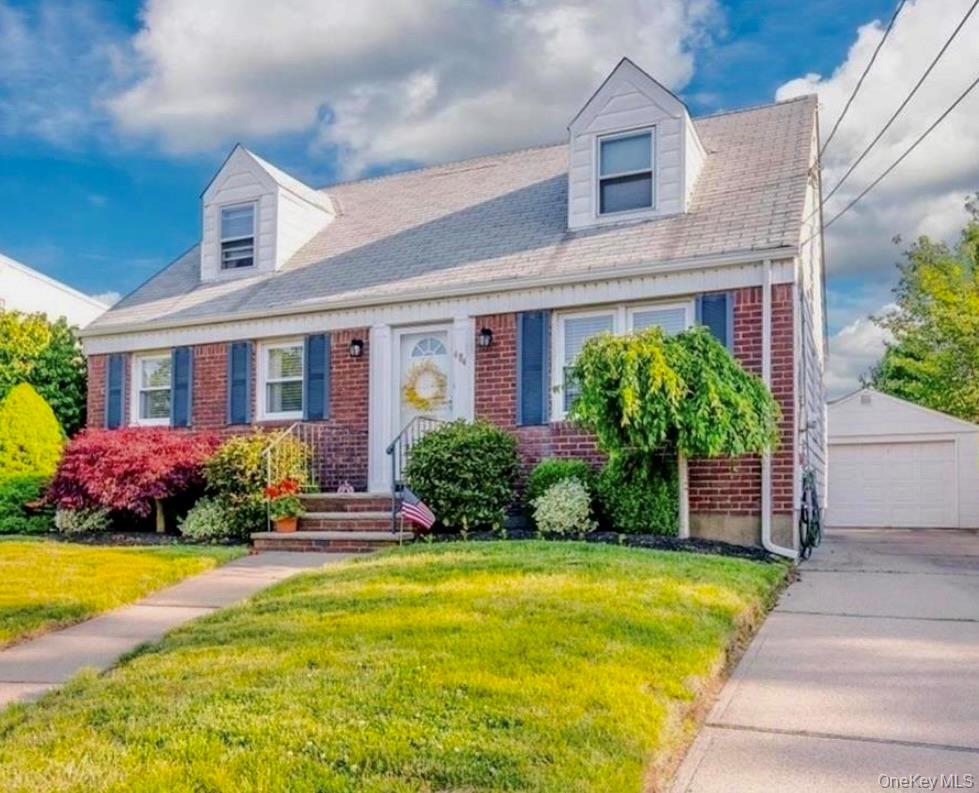 484 Chelsea Road Oceanside, NY 11572 - Photo 2 of 16 a front view of house with yard and green space