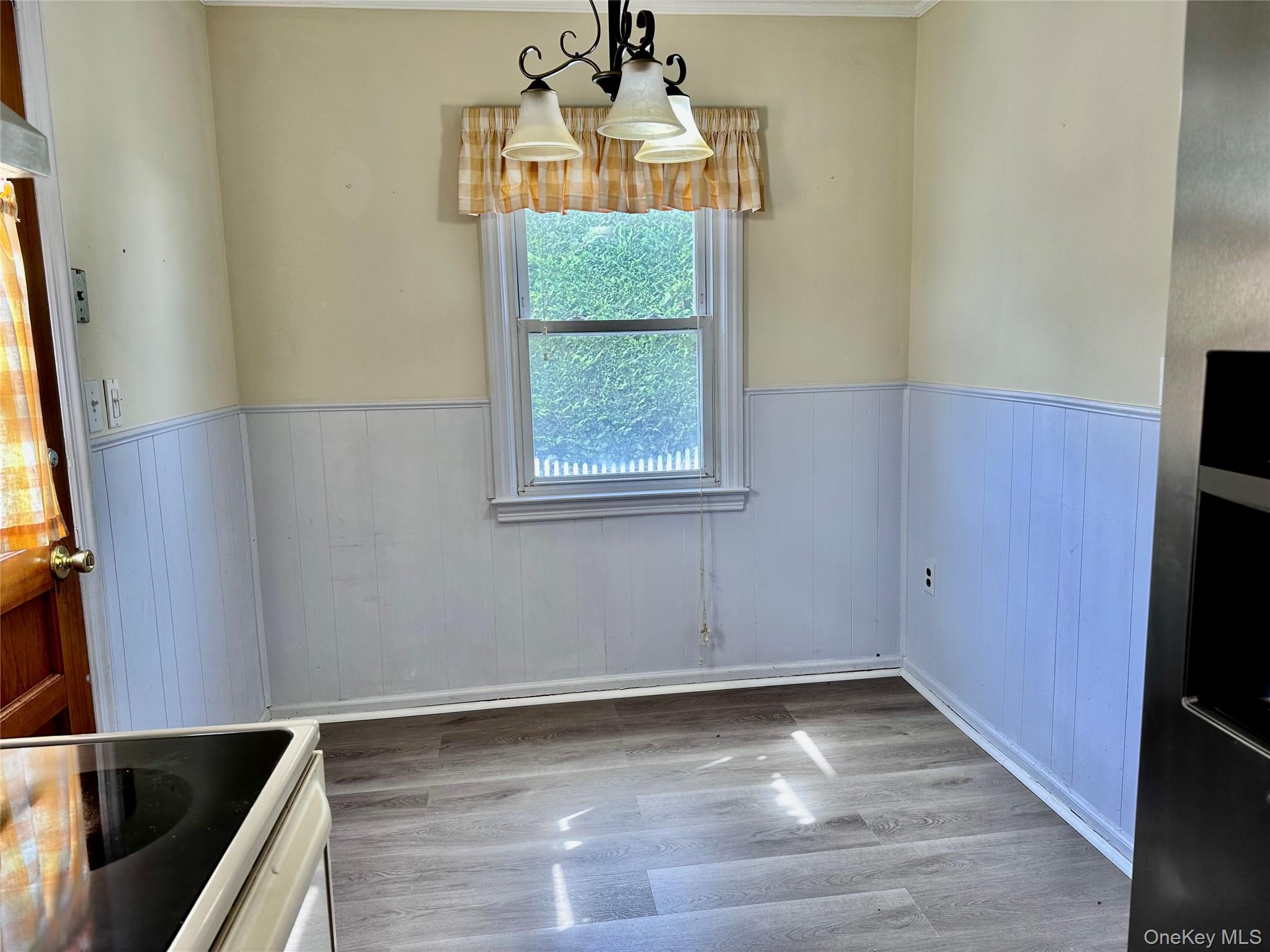 484 Chelsea Road Oceanside, NY 11572 - Photo 6 of 16 a view of an empty room and window