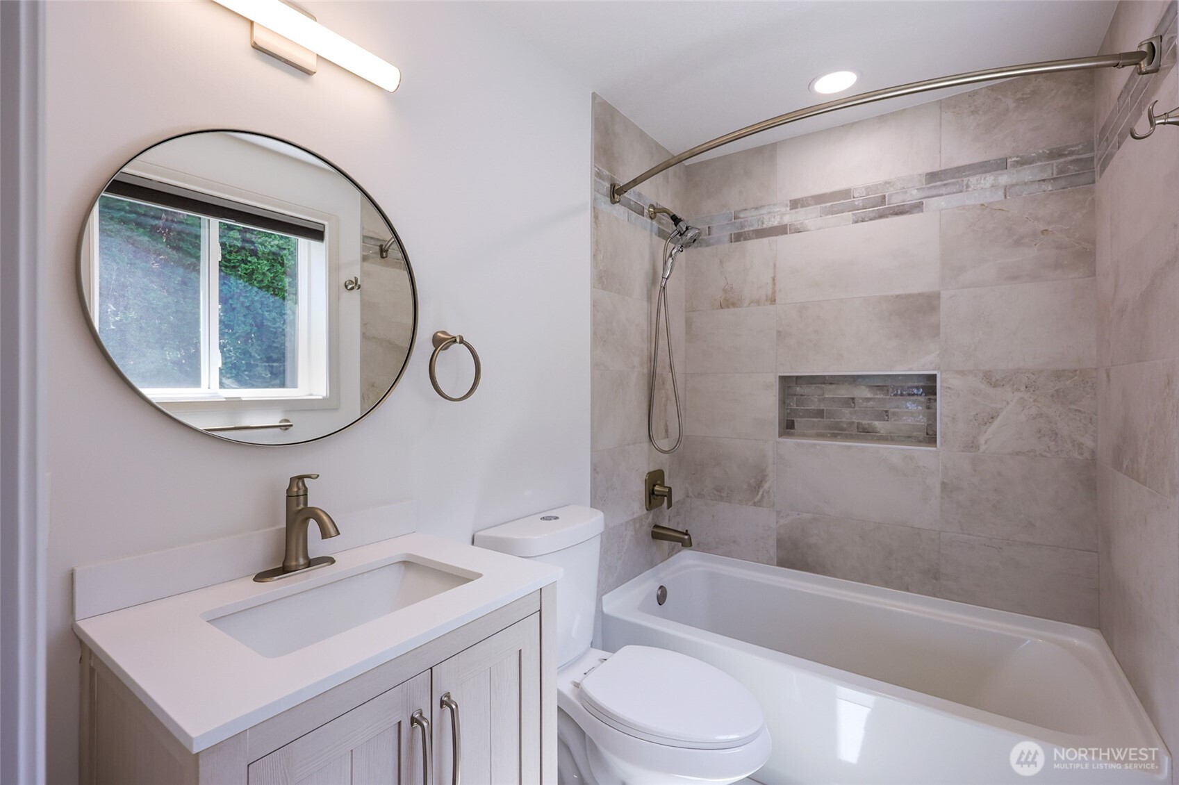 7713 78th Loop Northwest Olympia, WA 98502 - Photo 24 of 40 a bathroom with a sink a toilet and a mirror