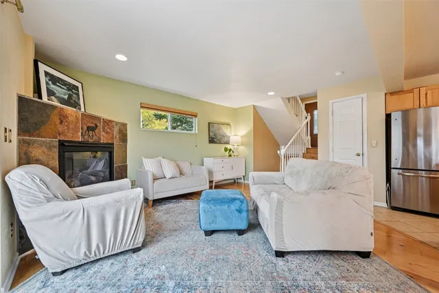 a living room with furniture and a fireplace
