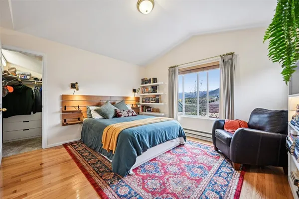 a bedroom with a bed furniture and a window