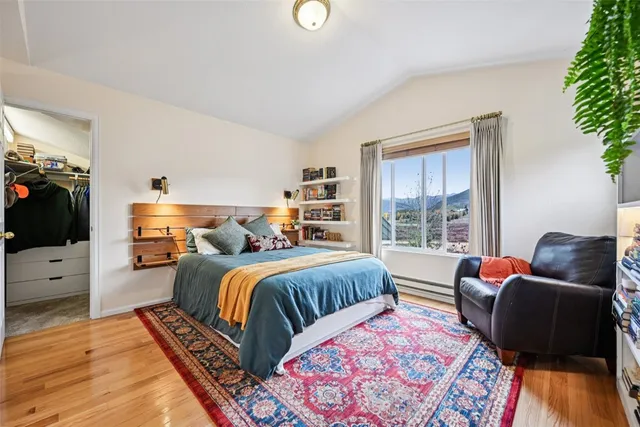 a bedroom with a bed furniture and a window