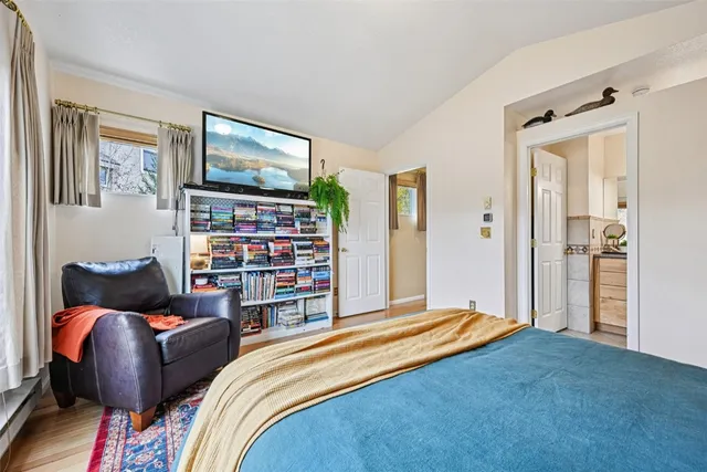 a bathroom with a granite countertop sink a toilet and a mirror