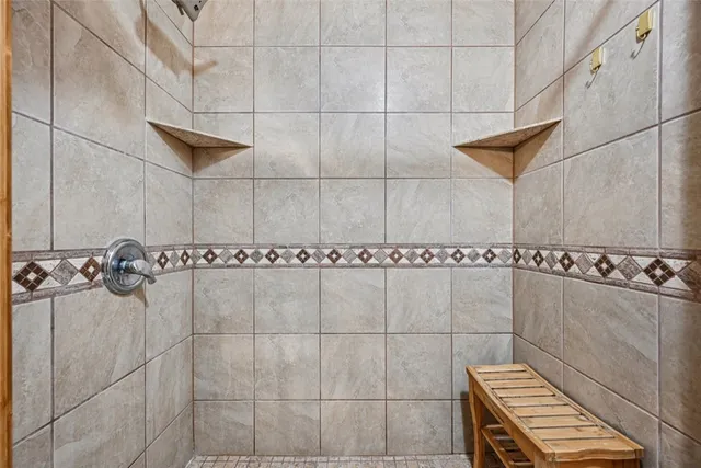 a living room with lots of books and a book shelf