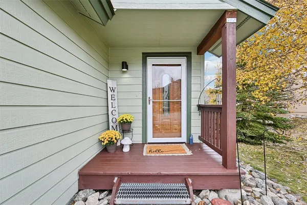 a kitchen with a sink and living room