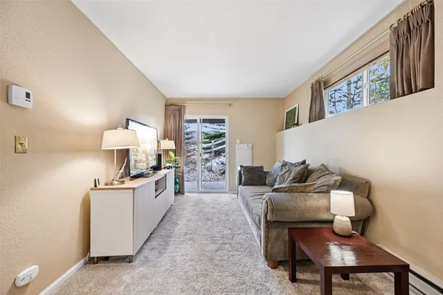 a bathroom with a toilet a sink and shower