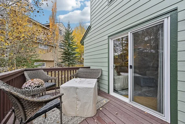 a view of a brick house with large windows