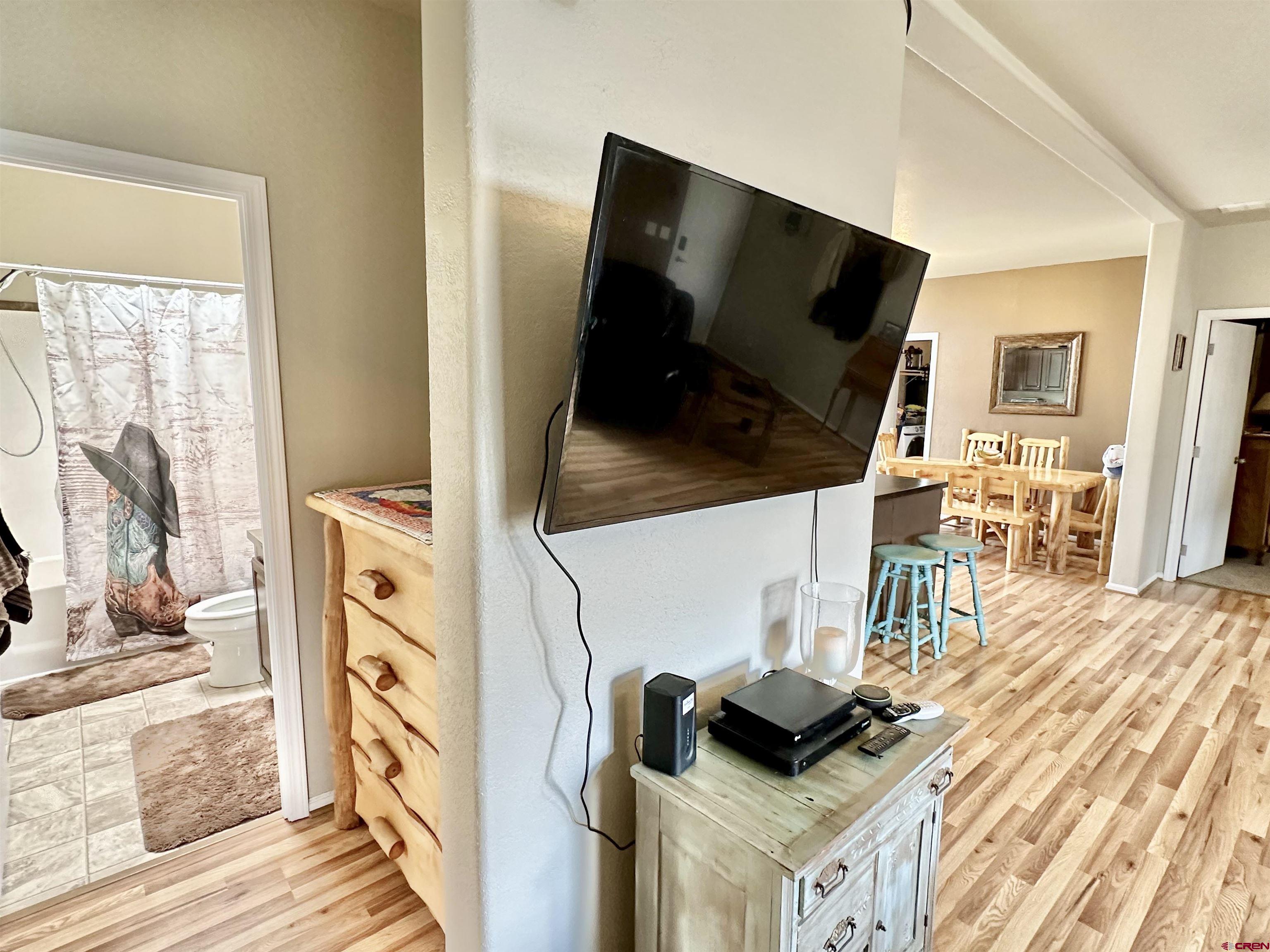 1678 Log Cabin Road Delta, CO 81416 - Photo 12 of 35 a living room with a flat screen tv and a couch