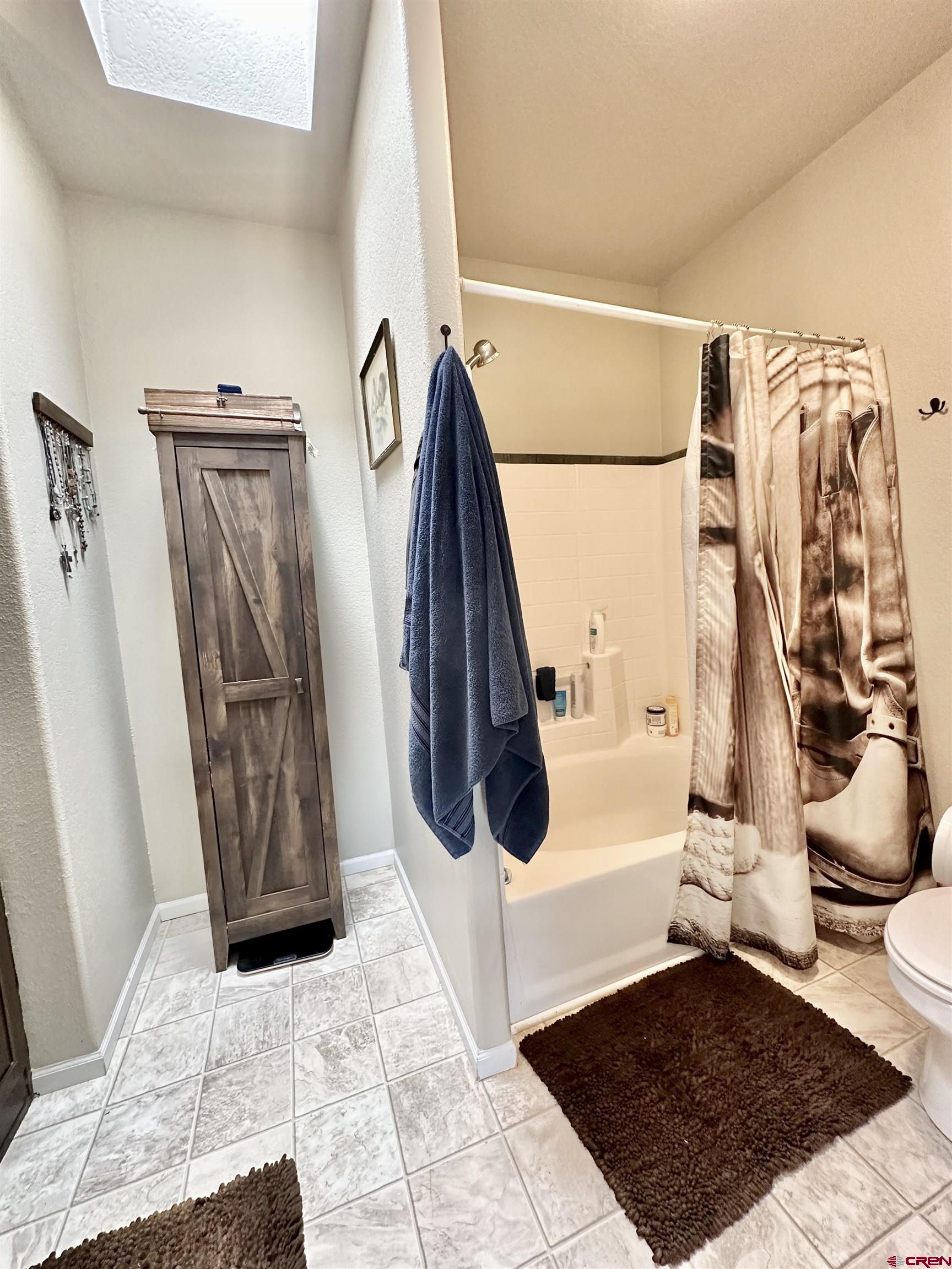 1678 Log Cabin Road Delta, CO 81416 - Photo 18 of 35 a view of a closet with wooden floor and a rug
