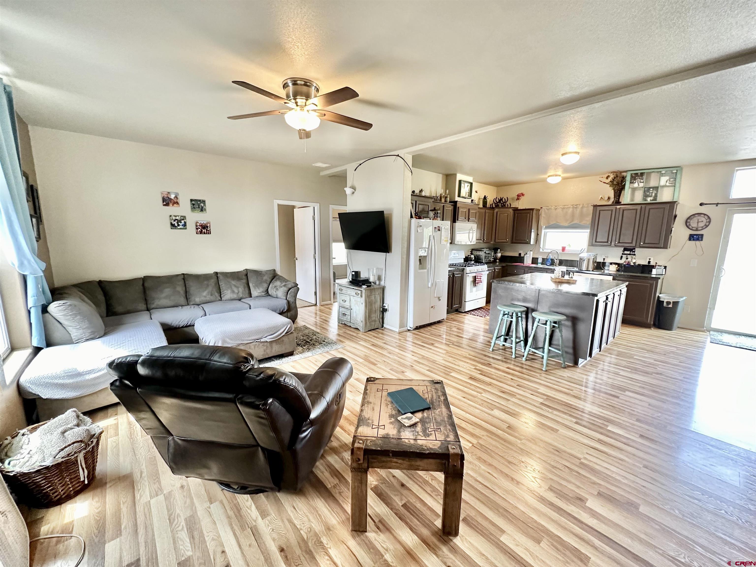1678 Log Cabin Road Delta, CO 81416 - Photo 8 of 35 a living room with furniture and a wooden floor