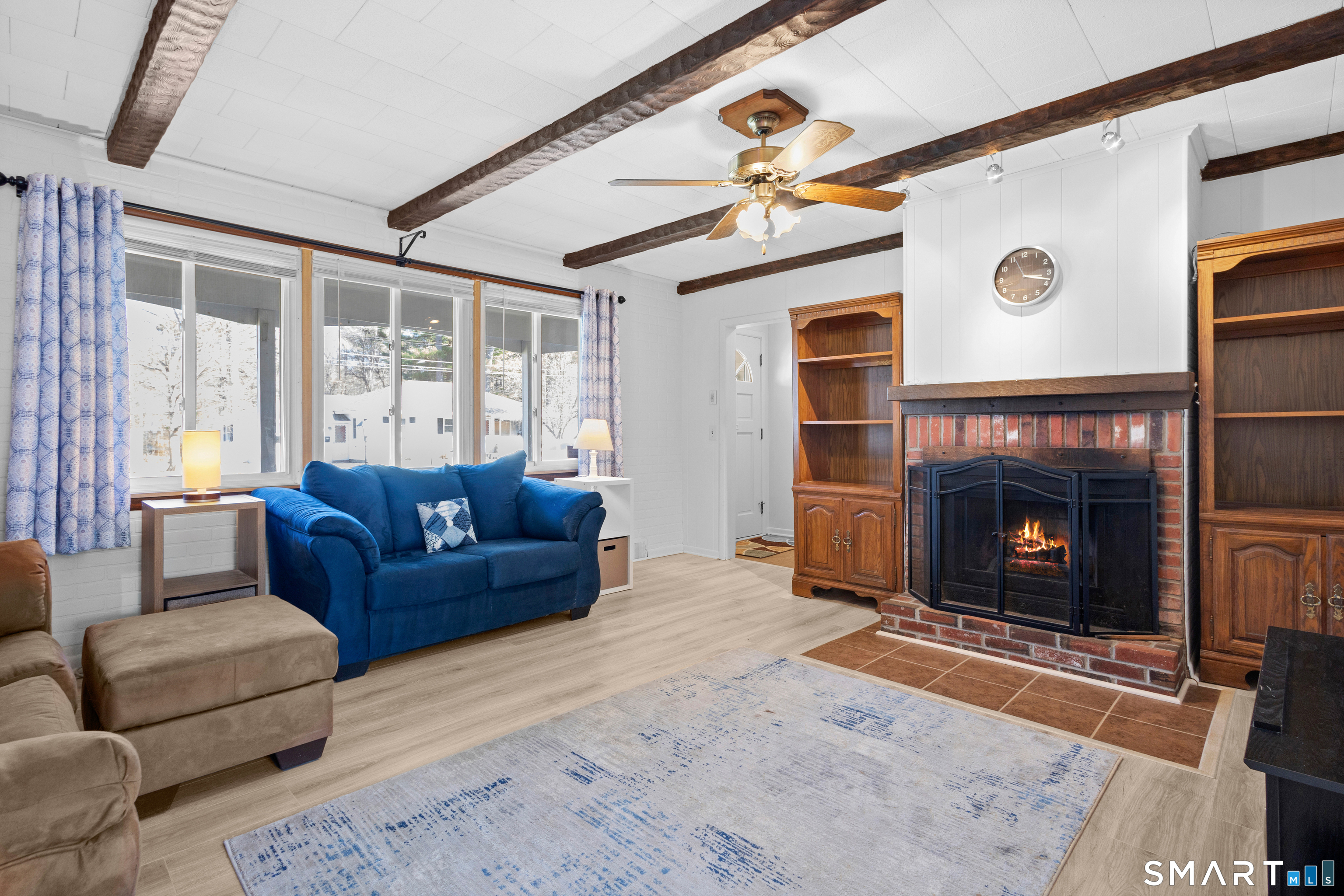 43 Woodward Street Killingly, CT 06239 - Photo 12 of 28 a living room with furniture and a fireplace