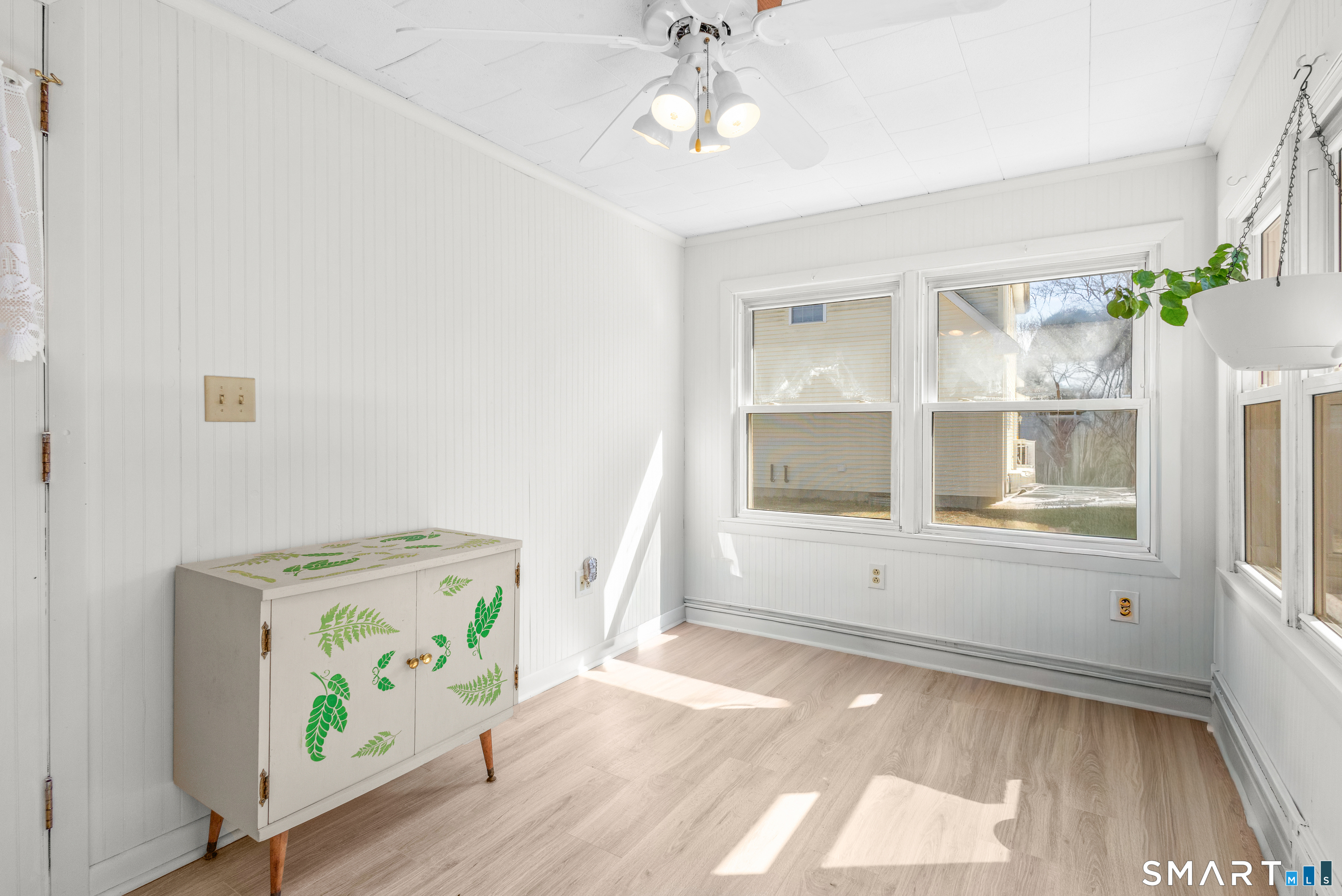 43 Woodward Street Killingly, CT 06239 - Photo 18 of 28 wooden floor in an empty room with a window