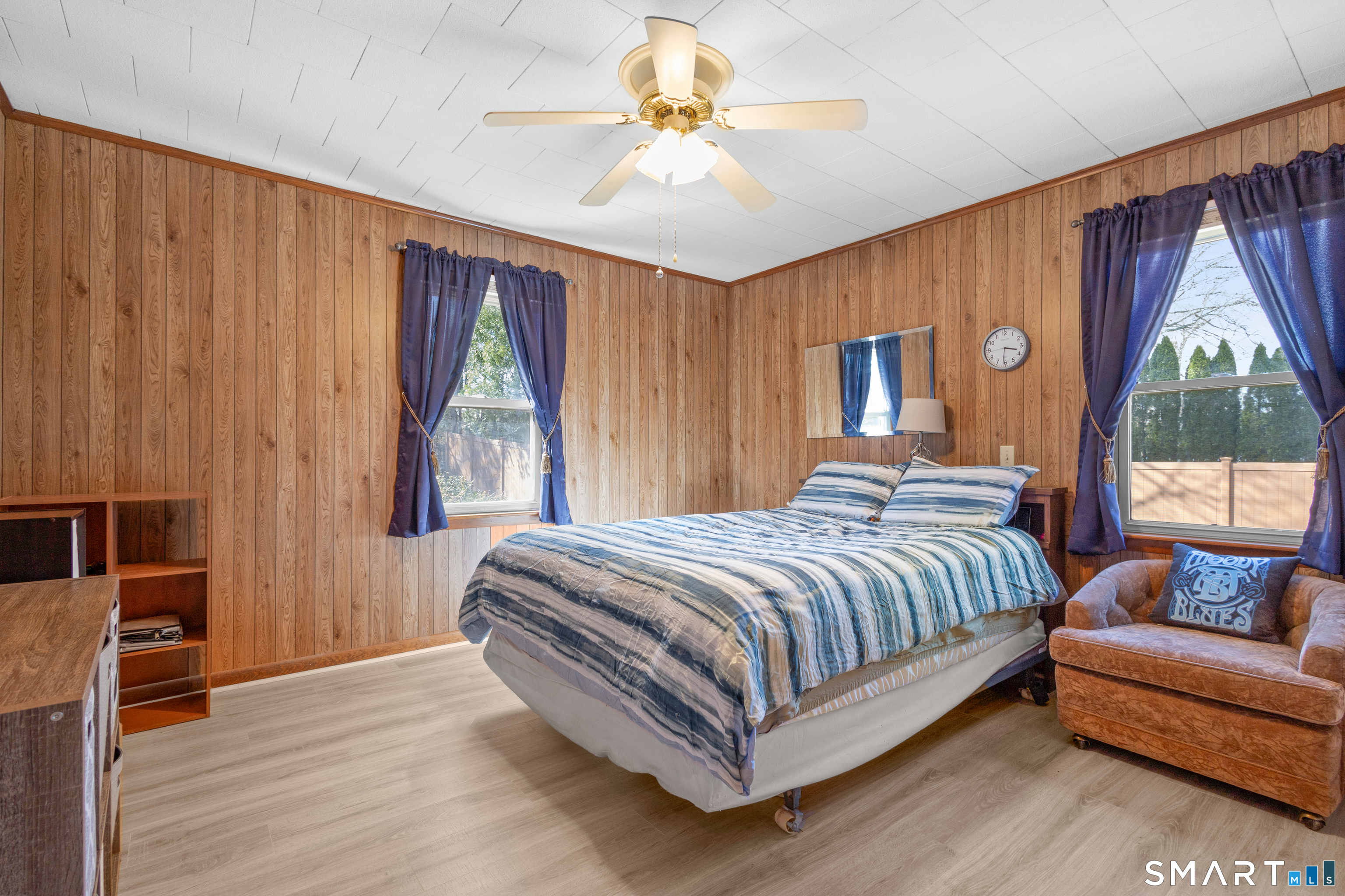 43 Woodward Street Killingly, CT 06239 - Photo 21 of 28 a spacious bedroom with a bed and a chandelier