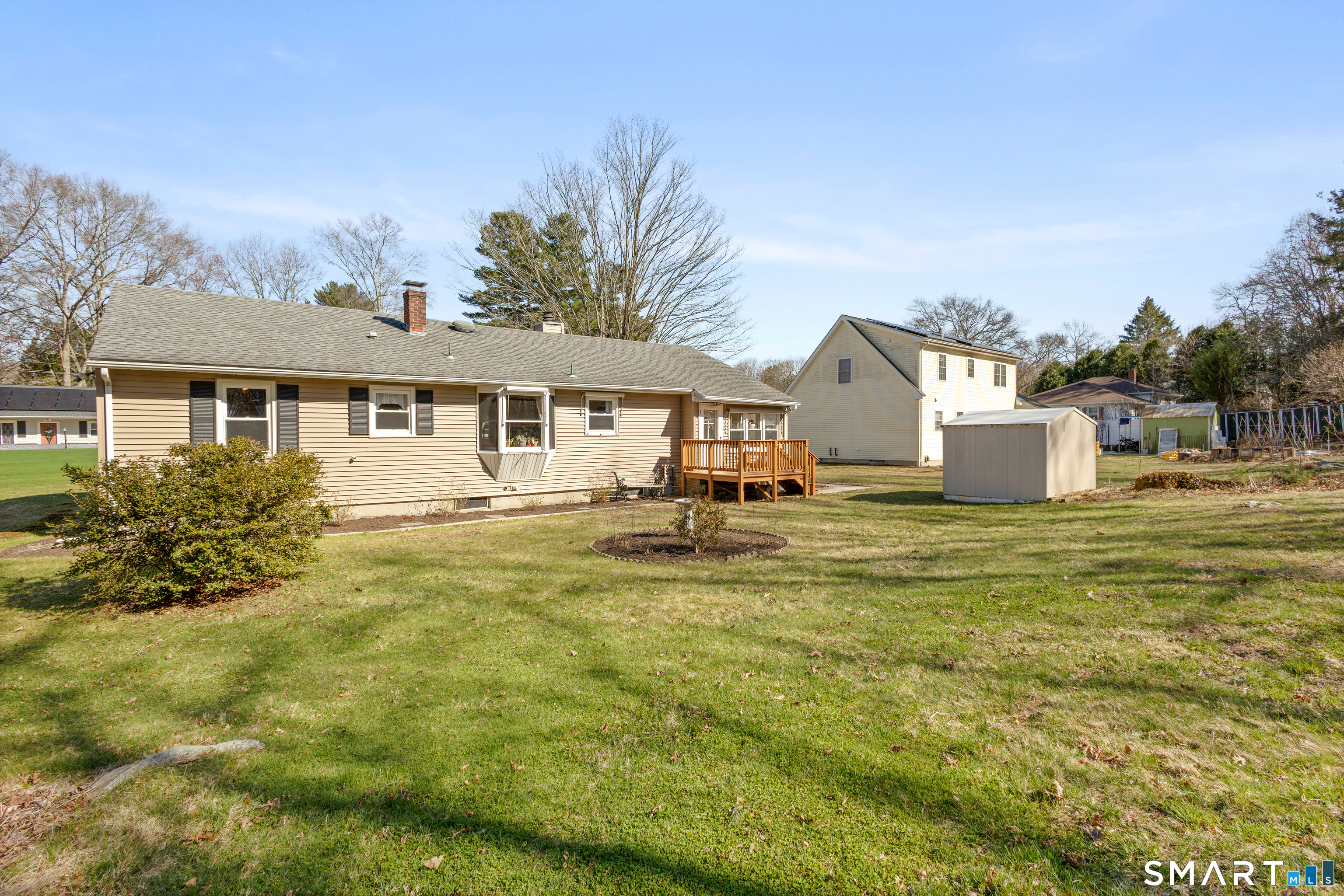 43 Woodward Street Killingly, CT 06239 - Photo 26 of 28 a view of a white house with a big yard and potted plants