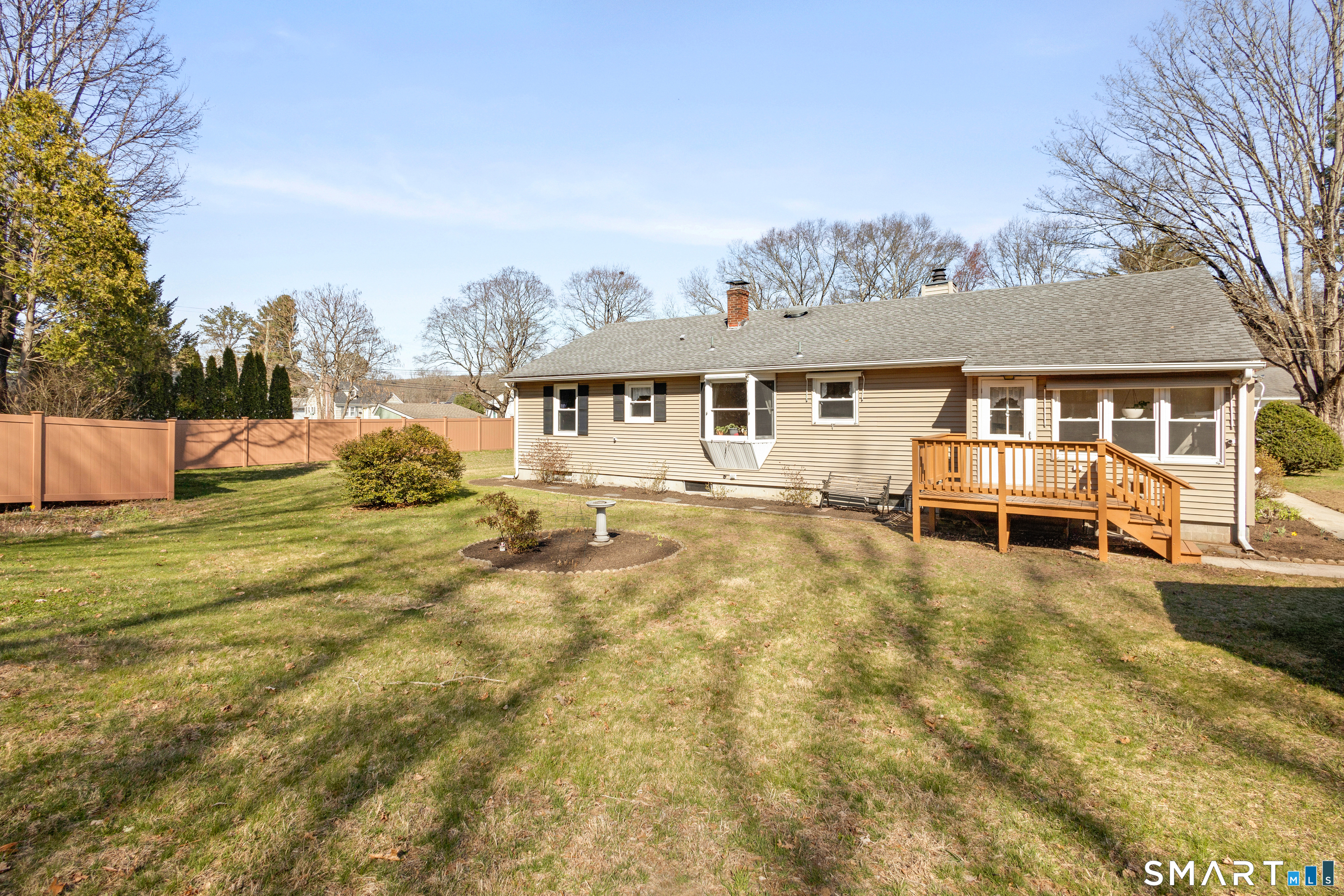 43 Woodward Street Killingly, CT 06239 - Photo 27 of 28 a view of a white house with a swimming pool and sitting area