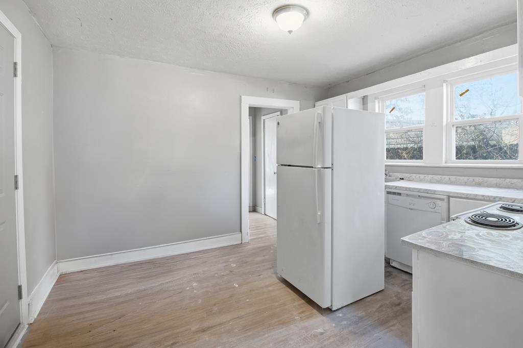 1404 18th Street Columbus, GA 31901 - Photo 20 of 20 a view of a kitchen with a refrigerator a sink and a dishwasher