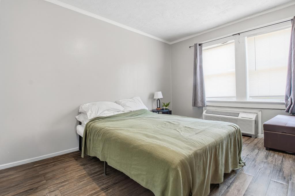1404 18th Street Columbus, GA 31901 - Photo 7 of 20 a bedroom with a bed and a window