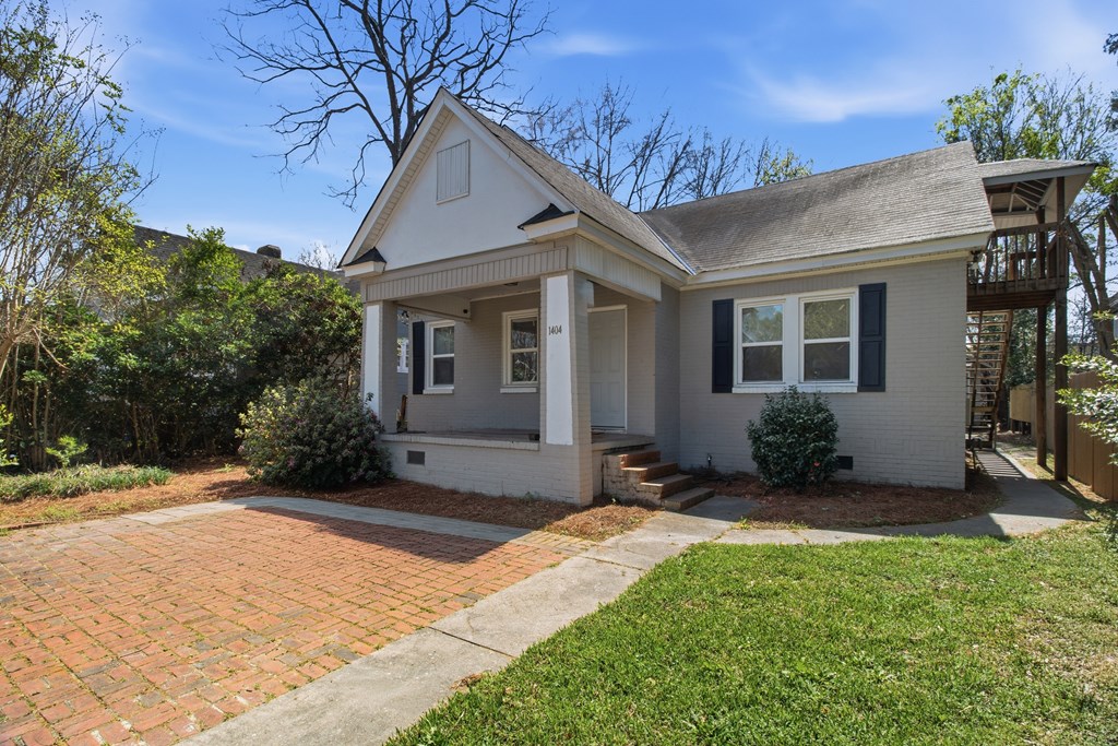 1404 18th Street Columbus, GA 31901 - Photo 8 of 20 a front view of a house with a yard and tree