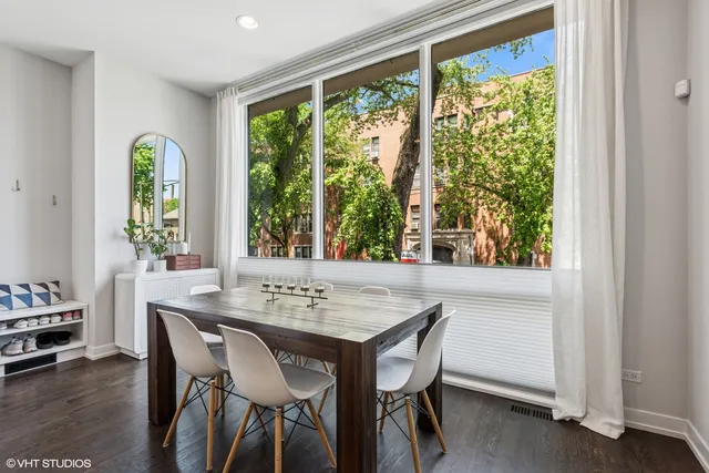 a view of a dining room with furniture window and outside view