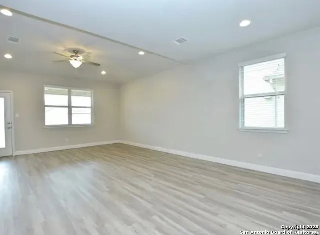 a view of an entryway door with wooden floor