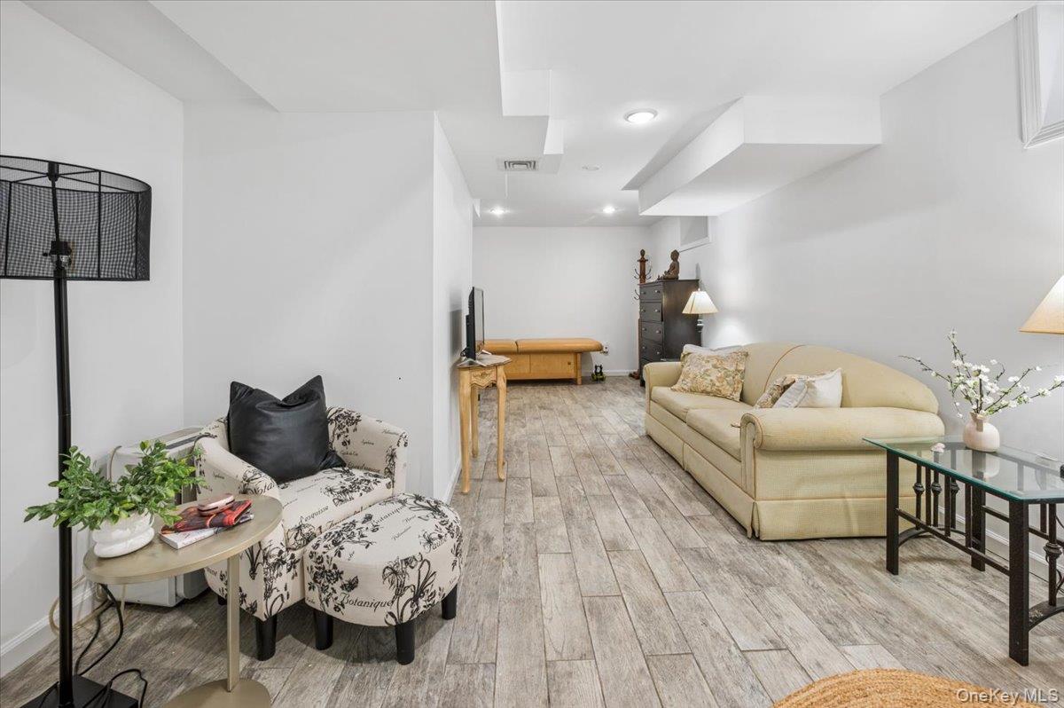 46 Bedford Road Katonah, NY 10536 - Photo 25 of 34 Finished room featuring light wood-finish flooring, white walls, recessed ceiling lighting, office or bedroom, and a visible ceiling bulkhead