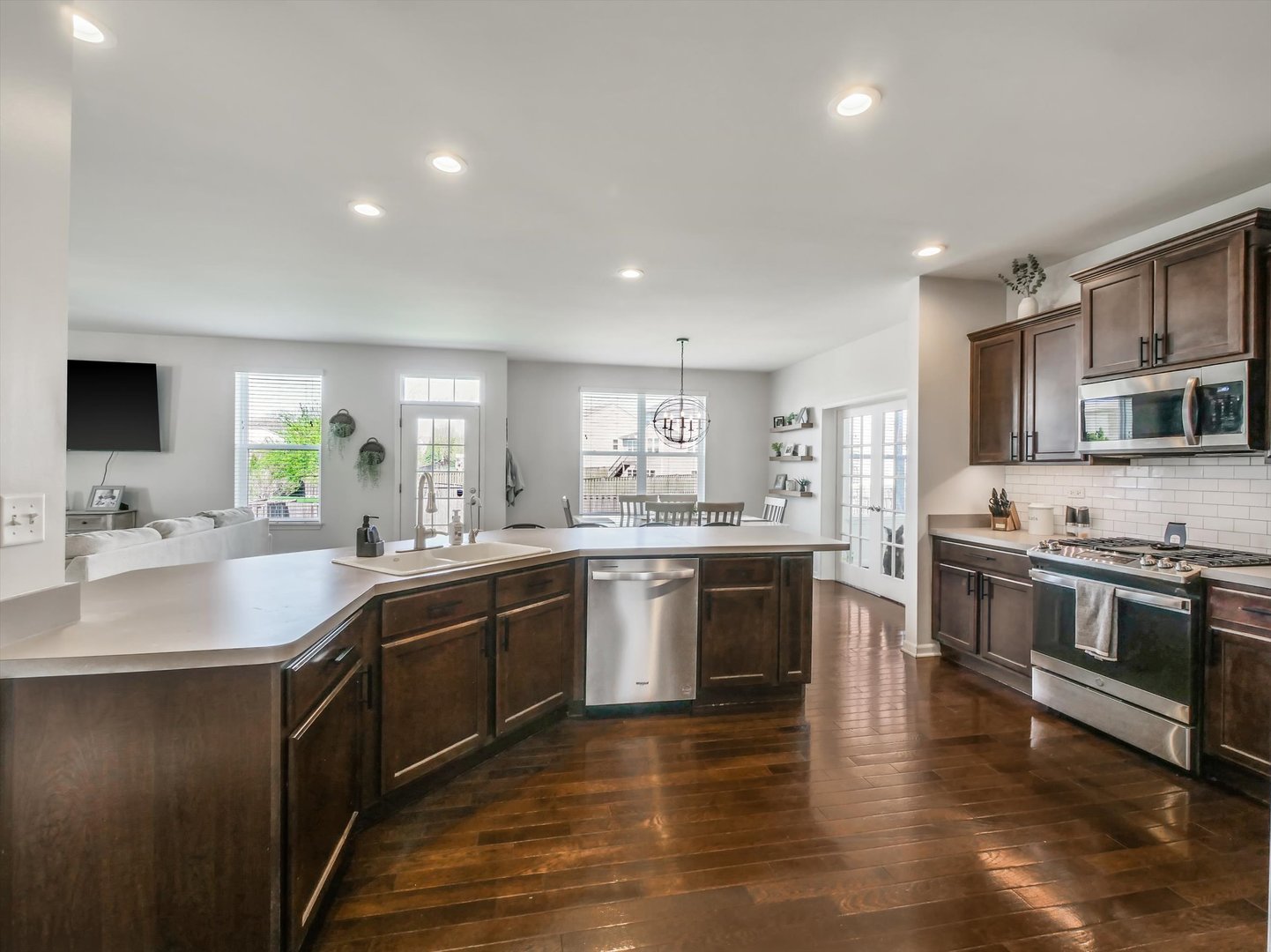32 Catamaran Circle Pingree Grove, IL 60140 - Photo 15 of 46 a large kitchen with stainless steel appliances granite countertop a sink and stove top oven