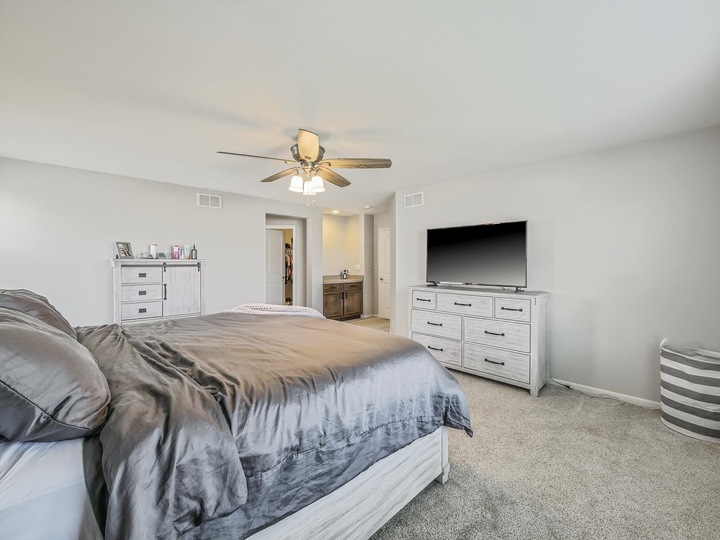 32 Catamaran Circle Pingree Grove, IL 60140 - Photo 20 of 46 a bedroom with a bed and a flat screen tv