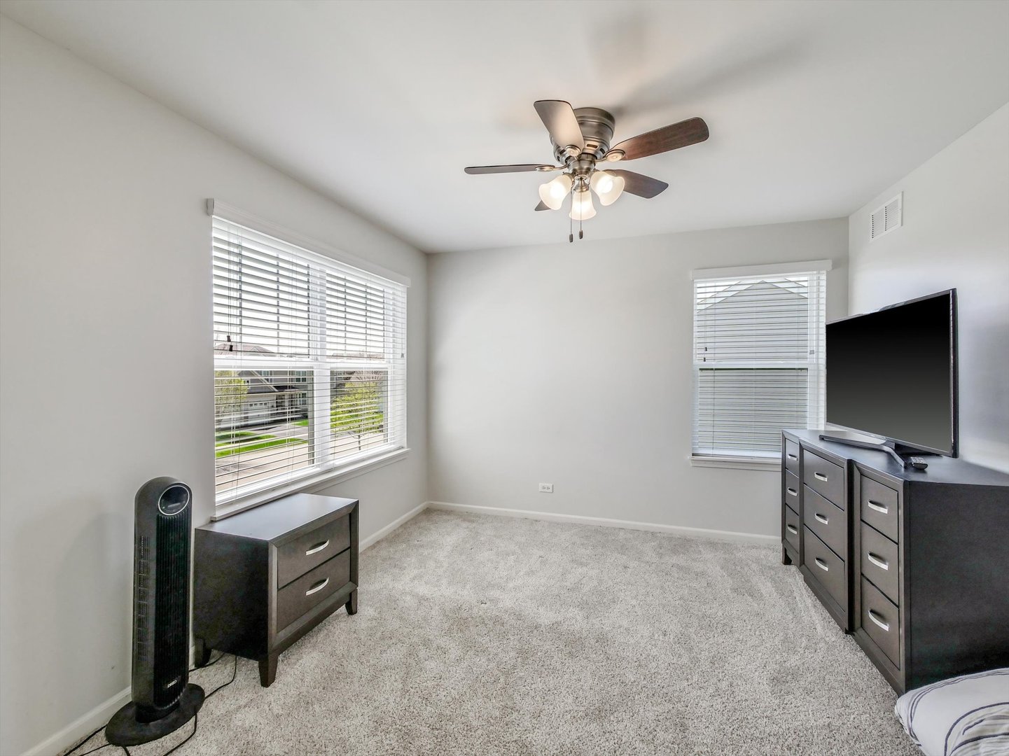 32 Catamaran Circle Pingree Grove, IL 60140 - Photo 25 of 46 a living room with furniture and a flat screen tv